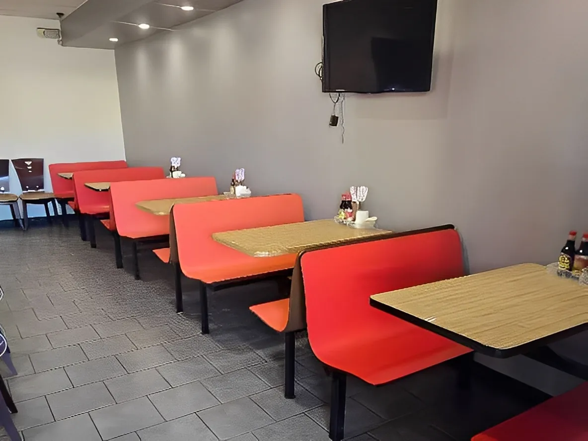 Dining area with red booths at Sweet Crisp Duck, a Chinese Restaurant in Newark