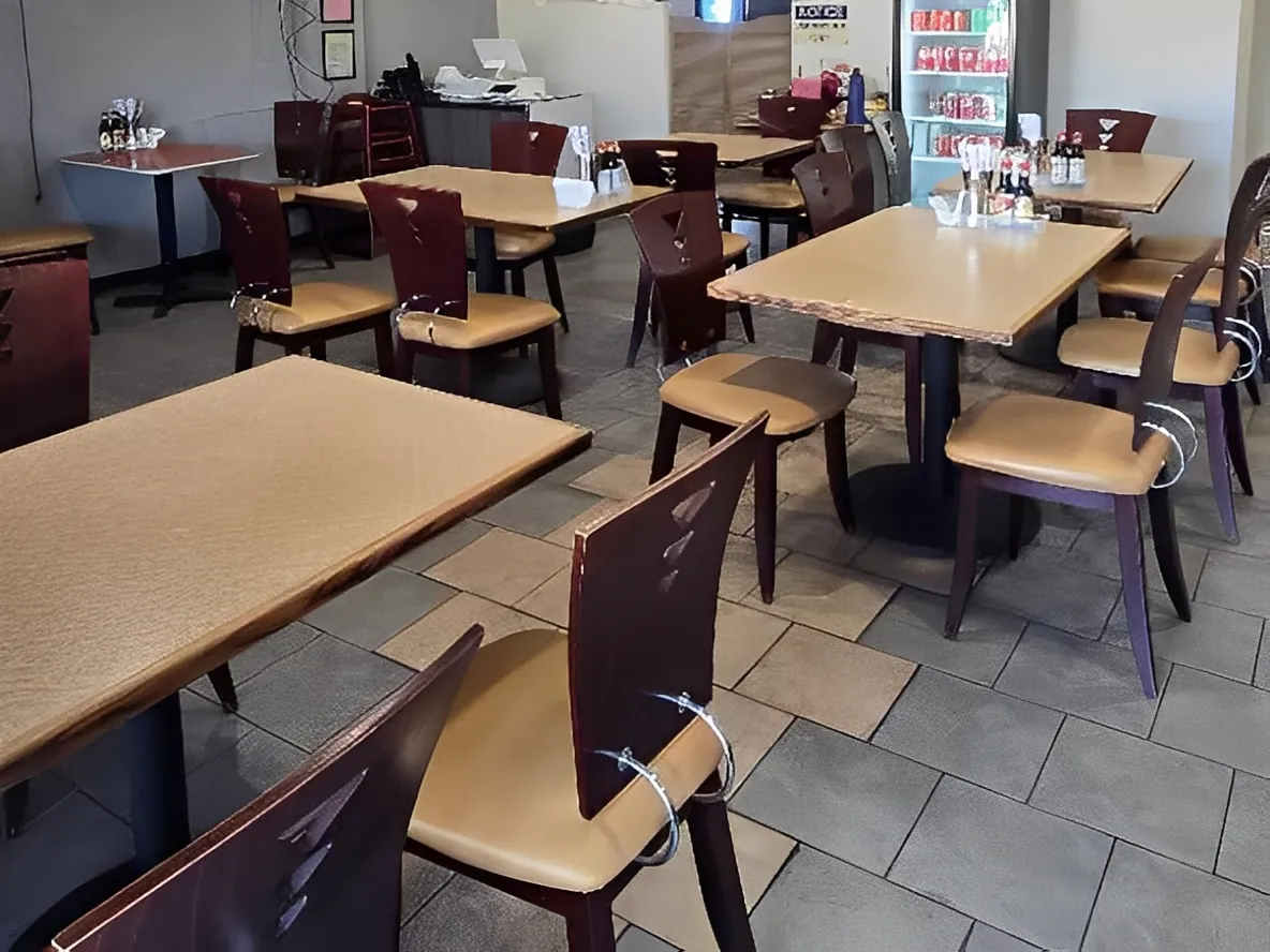 Dining area with brown chairs at Sweet Crisp Duck, a Chinese Restaurant in Newark